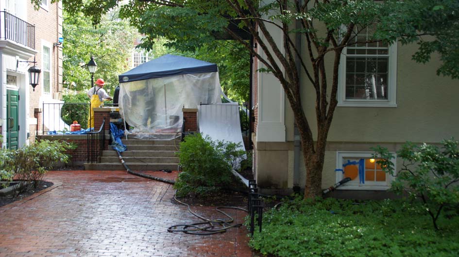 Grout had to be pumped through hoses inserted through a basement window. 