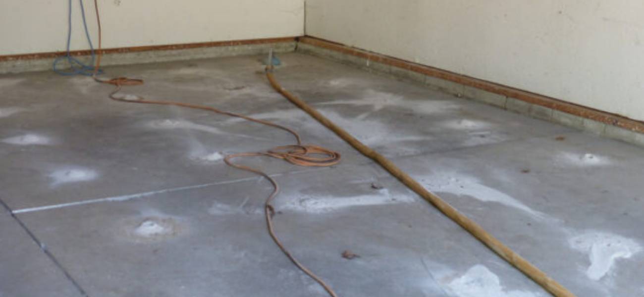 Cracks in a garage floor need to be repaired
