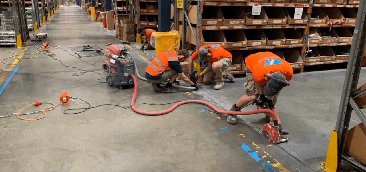 repairing concrete floor in warehouse